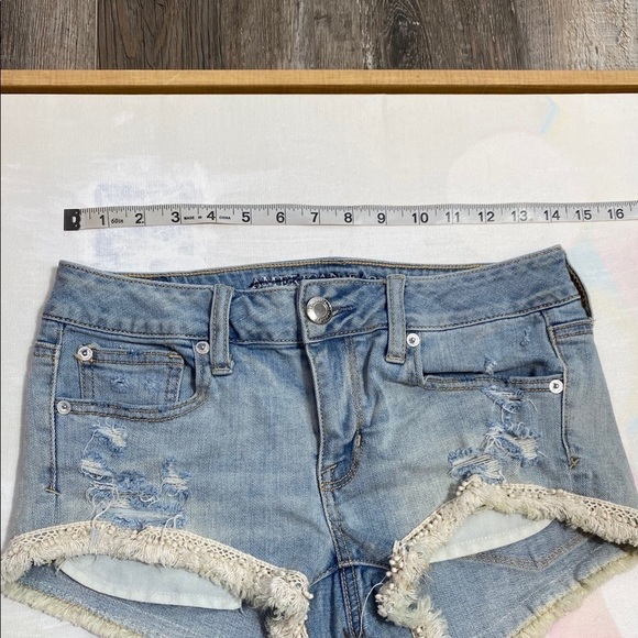 AE 4 shortie pom pom fringe distressed jean shorts - Picture 7 of 8
